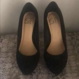 Black platform heels.